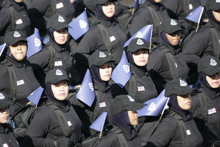Malaysian police women march during a parade to celebrate the force's 200th anniversary in Kuala Lumpur